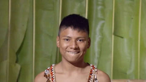 Young boy showing the upper teeth like in front of the dentist in ecuador Stock Footage 113217450