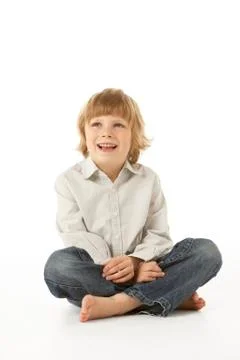 Young Boy Sitting In Studio Stock Photos