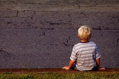 Young Boy Sitting on a Wall Stock Footage 371688