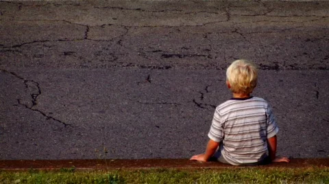 Young Boy Sitting on a Wall Stock Footage 371699