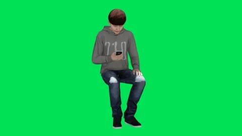 Young boy sitting working on the phone and talking from three sides Video stock 246730988