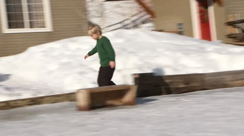 Young boy skates on backyard ice rink Video stock 935905