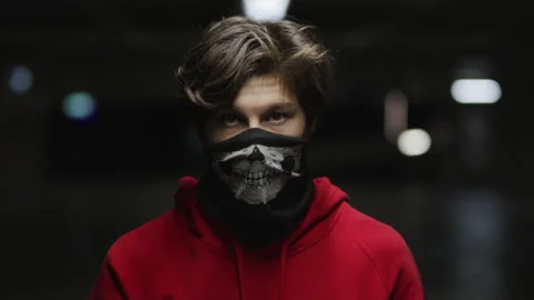 Young boy with the skull mask looking directly into the camera Stock Footage 264201005