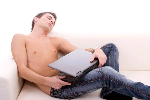 Young boy sleeping on couch Stock Photos