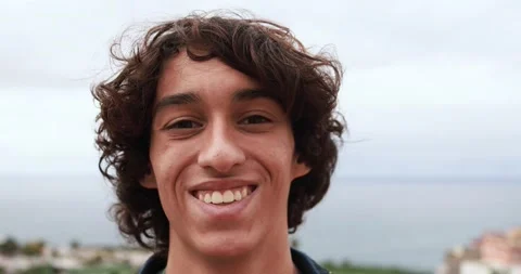 Young boy smiling on camera outdoor Stock Footage 164378999