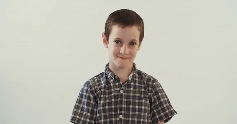Young boy smiling on white studio background Stock Footage 69761723
