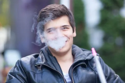 Young boy smoke the hookah Stock Photos