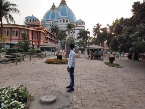 Young boy standing front of iskcon temple in mayapur, tovp temple, Mayapur. Stock Photos