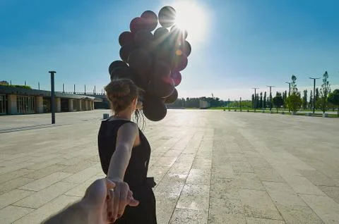 A young boy standing on a sidewalk Stock Photos