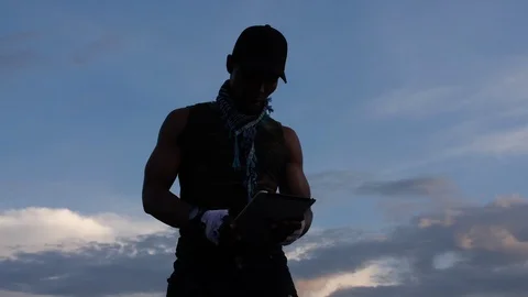 Young boy standing in skatepark using cell phone 4K clip Stock Footage 113118835
