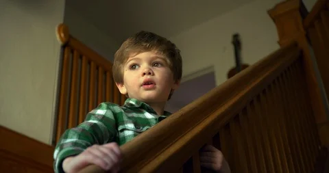 Young boy standing on a staircase. 스톡 동영상 88376195