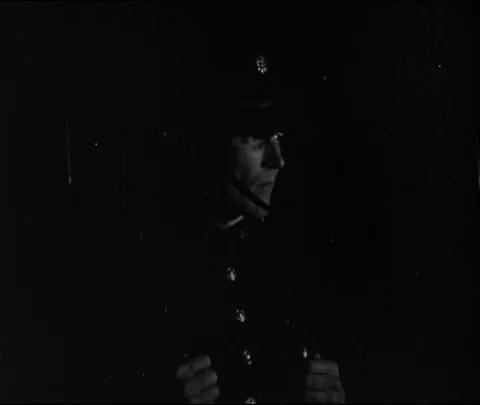 Young boy stealing a bread from a shop, United Kingdom, UK, 1946 Video stock 133379046