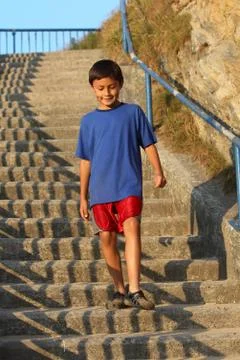 Young boy on steps Stock Photos