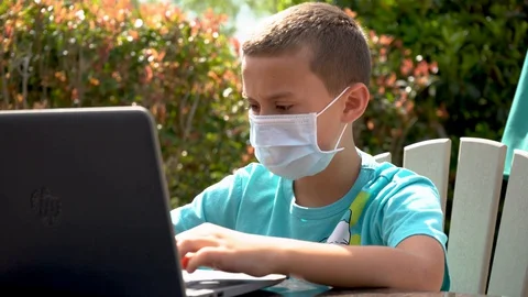 Young boy student on laptop with mask coronavirus Stock Footage 128133003