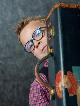 Young boy with a suitcase Stock Photos
