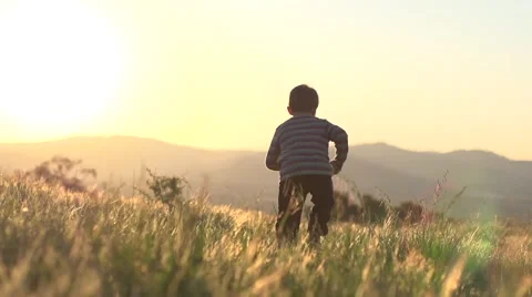 Young boy sunset / sunrise Stock Footage 56287280