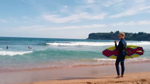 Young boy with surf board Stock Footage 138739464