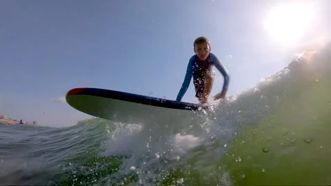 Young boy surfing Stock-Footage 135664047
