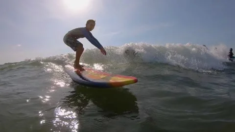 Young boy surfing Stock Footage 135664074