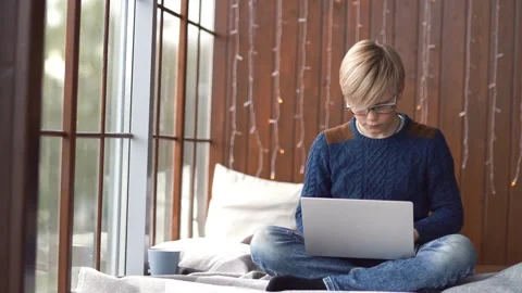 Young boy t in sweater studying on laptop. Stock Footage 161153264