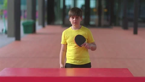 Young Boy with Table Tennis Paddle Stock Footage 336274580