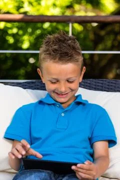 Young boy with tablet Stock Photos