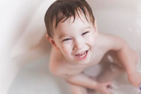 Young Boy Taking a Bath Stock Photos