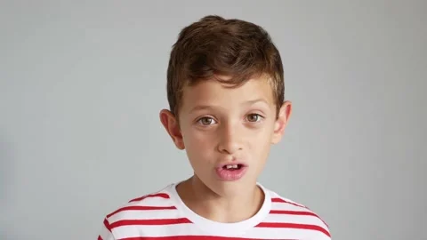 Young boy talking to the camera Stock Footage 138698108