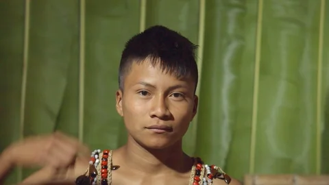 Young boy telling the viewer that something crazy is going on in ecuador 스톡 동영상 113180777