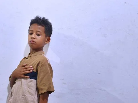 Young boy with a thoughtful expression Stock Photos