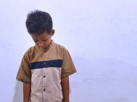 Young boy with a thoughtful expression Stock Photos