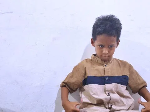 Young boy with a thoughtful expression Stock Photos