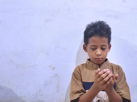 Young boy with a thoughtful expression Stock Photos