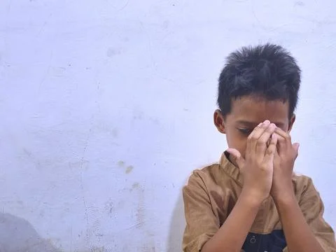 Young boy with a thoughtful expression Stock Photos