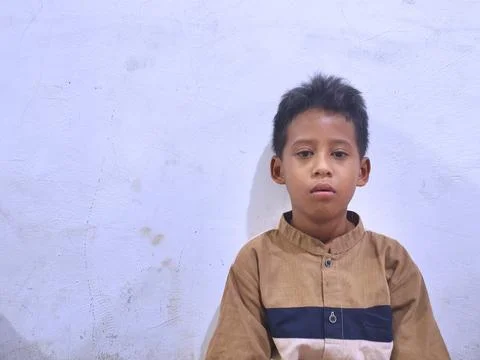 Young boy with a thoughtful expression Stock Photos