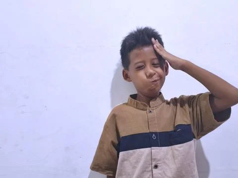 Young boy with a thoughtful expression Stock Photos