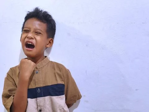 Young boy with a thoughtful expression Stock Photos