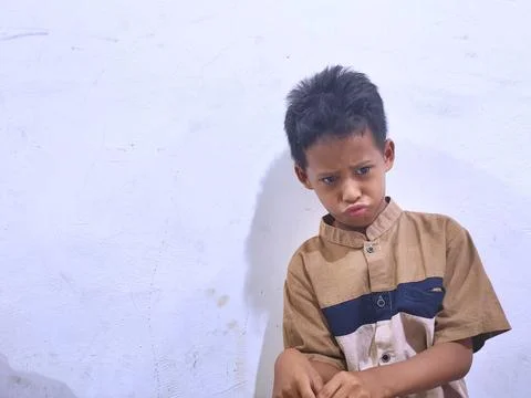 Young boy with a thoughtful expression Stock Photos