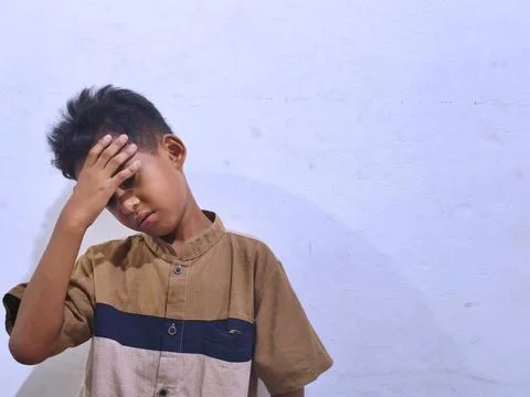 Young boy with a thoughtful expression Stock Photos