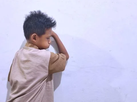 Young boy with a thoughtful expression Stock Photos