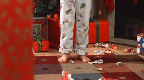 Young boy throws Christmas wrapping paper, slow motion Video stock 62282569