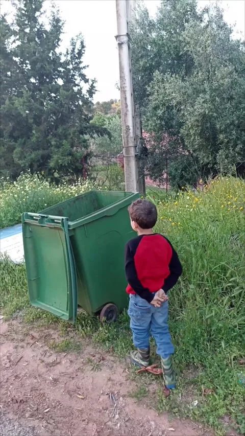 Young Boy Tossing Garbage into the Recycling Bin Stock Footage 333531049