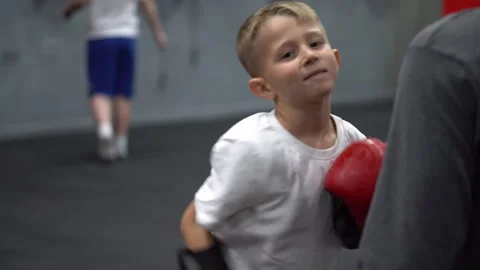 Young boy training boxing with gloves in gym sport practice 스톡 동영상 330245408