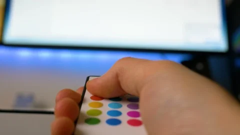 Young boy turning on the led stripes and change colours Stock Footage 87379232
