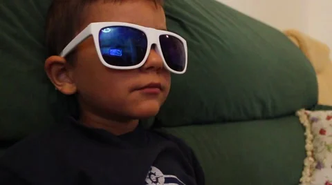 A young boy turns his head in glasses Stock-Footage 65300343