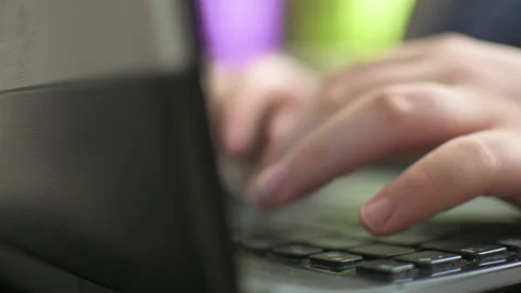 Young boy typing on laptop Stock Footage 152956747