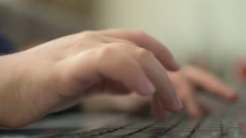 Young boy typing on laptop Stock Footage 152956799