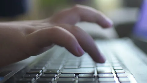 Young boy typing on laptop Stock Footage 152957843