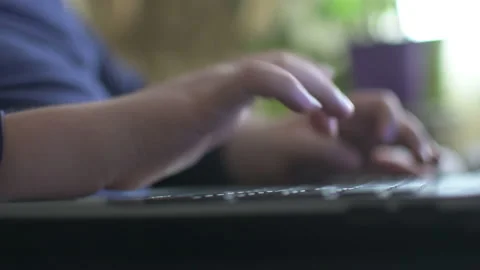 Young boy typing on laptop Stock Footage 152957885