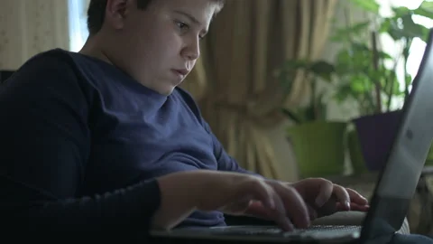 Young boy typing on laptop Stock Footage 152958208